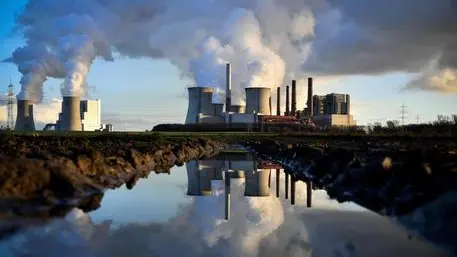 epa07208455 Steam rises from the brown coal-fired power plant Neurath (C) and Niederaussem (L) operated by RWE in Bergheim, 04 December 2018. The Rhenish Brown Coal Field is Europe's largest carbon dioxide source. According to a report by the UN, the carbon dioxide (CO2) emissions have gone up for the first time in four years. The report came just days ahead of the COP24 United Nations Climate Change Conference taking place in Poland from 02 to 14 December 2018. EPA/SASCHA STEINBACH