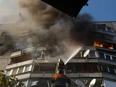 epaselect epa11606316 Ukrainian rescuers work at the site of a damaged residential building after shelling in Kharkiv, northeastern Ukraine, 15 September 2024, amid the Russian invasion. At least 41 people, including four children, have been injured after a Russian air strike hit a multi-storey residential building in Kharkiv, Ukraine's State Emergency Service (SESU) said, adding that a rescue operation was ongoing at the site of the attack. Russian troops entered Ukrainian territory on 24 February 2022, starting a conflict that has provoked destruction and a humanitarian crisis. EPA/SERGEY KOZLOV