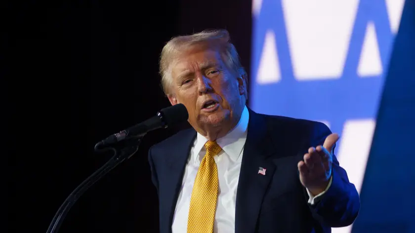 epa11614965 Republican presidential candidate Donald Trump delivers remarks at the Israeli American Council (IAC) Conference at the Washington Hilton in Washington, DC, USA, 19 September 2024. EPA/WILL OLIVER