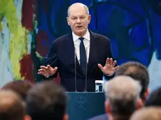 epa11633976 German Chancellor Olaf Scholz gestures as he speaks at the Chancellery in Berlin, Germany, 30 September 2024. German Chancellor Olaf Scholz, Chair of the Executive Board of the Federal Employment Agency Andrea Nahles and German Labour Minister Hubertus Heil delivered speeches in front of guests on the so called 'Job Turbo' program, for the labor market integration of refugees. EPA/CLEMENS BILAN