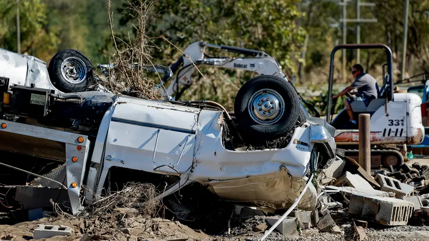 epa11638999 A destroyed vehicle from V J's Auto Service, a 40-year-old vehicle maintenance shop, in the River Arts District in the aftermath of catastrophic flooding caused by Tropical Storm Helene in Asheville, NC, USA, 02 October 2024. The mountainous areas of North Carolina, South Carolina and Tennessee were hit particularly hard. More than 150 people are reported dead due to Hurricane Helene in the Southeastern US. Many of the businesses and building owners did not have flood insurance. EPA/ERIK S. LESSER