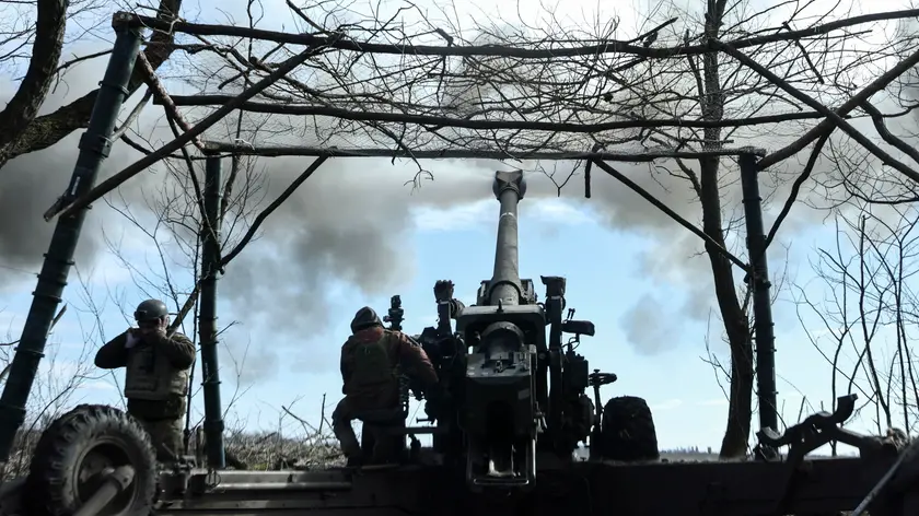 epa10500960 Ukrainian soldiers fire a FH70 howitzer from their position in the Zaporizhzhia area, Ukraine, 02 March 2023 (issued 03 March 2023) Russian troops entered Ukrainian territory on 24 February 2022, starting a conflict that has provoked destruction and a humanitarian crisis. EPA/STR