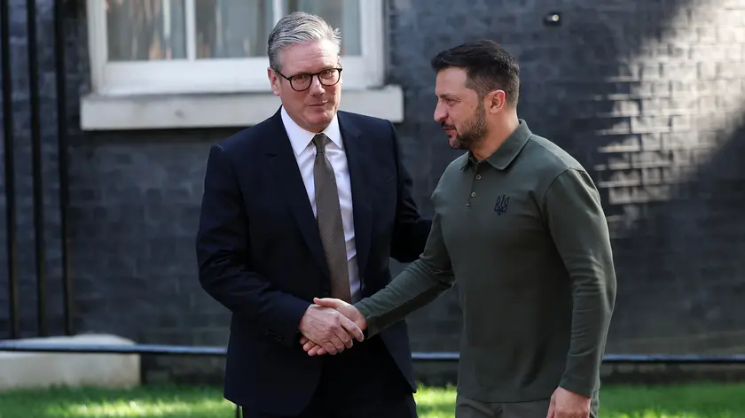 epa11487074 British Prime Minister Keir Starmer (L) welcomes Ukrainian President Volodymyr Zelensky (C) to 10 Downing Street in London, Britain, 19 July 2024. The Ukrainian president will address an extraordinary meeting of Britain's new cabinet on 19 July, according to the Downing Street press office. EPA/ANDY RAIN