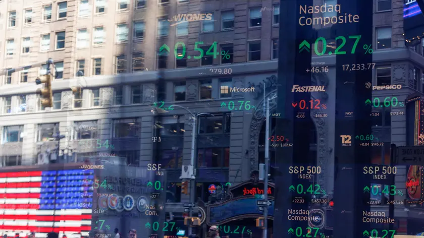 epa11549029 Stock prices are listed on a screen as seen through the window at the Nasdaq MarketSite in New York, New York, USA, 14 August 2024. US stocks, including Dow Jones Industrial Average, went up on 14 August after the release of US inflation data. The Consumer Price Index cooled to 2.9 percent in July 2024, down from 3 percent in June, the Bureau of Labor Statistics reported on 14 August. EPA/SARAH YENESEL