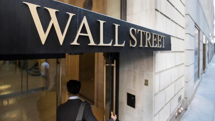 epa10010936 A sign on a building on Wall Street near the New York Stock Exchange in New York, New York, USA, 13 June 2022. The Dow Jones industrial average lost nearly 900 points in morning trading and the S&P 500 went into bear-market territory as investors continued to react to the economy’s ongoing inflation. EPA/JUSTIN LANE