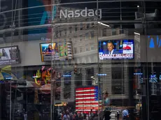 epa11528584 People walk past the Nasdaq in New York, USA, 05 August 2024. US indexes dropped at opening as stock markets around the world are declining from large sell-offs while investors continue to react to a report released last week by the United States Bureau of Labor Statistics showing the unemployment rate in the United States rose to 4.3 percent in July 2024. EPA/JOHN TAGGART