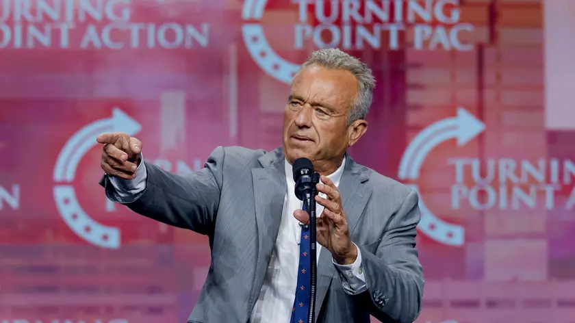 epa11678948 Former presidential candidate Robert F. Kennedy Jr speaks before former US president and Republican presidential nominee Donald Trump at the Turning Point PAC campaign rally at the Gas South Arena, in Duluth, Georgia, USA, 23 October 2024. Trump is running against Democratic US Vice President Kamala Harris. EPA/ERIK S. LESSER