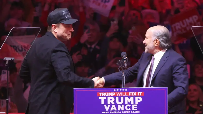 epa11688255 Howard Lutnick, Chairman and CEO of Cantor Fitzgerald (R), greets Elon Musk, businessman, (L), during a rally held for former US President and Republican presidential candidate Donald Trump, at Madison Square Garden in New York, New York, USA, 27 October 2024. Trump is facing US Vice President and Democratic presidential candidate Kamala Harris in the upcoming election on 05 November 2024. EPA/SARAH YENESEL