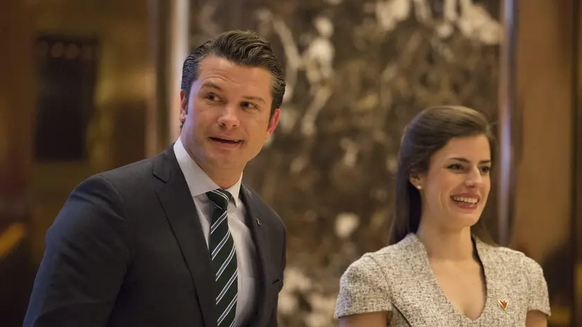 epa05677061 Pete Hegseth (L), a reported contender for the position of Veterans Affairs Secretary, walks in the lobby of Trump Tower in New York, New York, USA, 15 December 2016. EPA/Albin Lohr-Jones / POOL