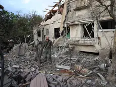 epa11738341 Israeli security forces inspect the scene where a rocket fired from Lebanon hit a house in Moshav Rinatya, outside Petah Tikva, Israel, 24 November 2024, amid cross-border hostilities between Hezbollah and Israel. Israel's military stated on 24 November that around 10 projectiles were fired from Lebanon towards central Israel, the majority of which were intercepted. Around 160 rockets were fired from Lebanon into Israel on 24 November, the army added. EPA/ABIR SULTAN