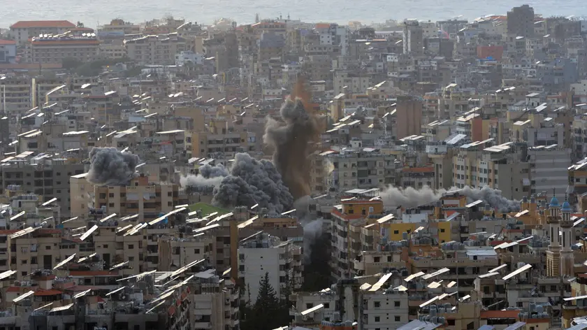 epa11738508 Smoke and debri rise during an Israeli airstrike on the Dahieh district in southern Beirut, Lebanon, 24 November 2024. According to the Lebanese Ministry of Health, more than 3,600 people have been killed and more than 15,400 others injured in Lebanon since the escalation in hostilities between Israel and Hezbollah. EPA/WAEL HAMZEH