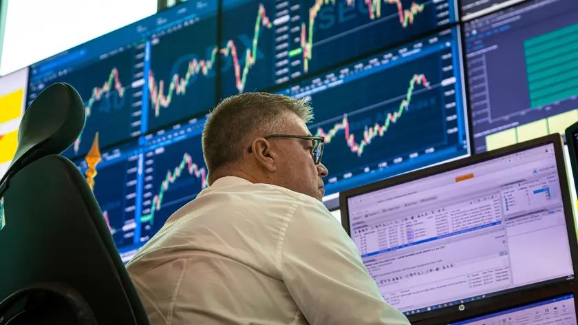 epa10538191 A market operator works in the operations room at the Euronext stock exchange headquarters in the Paris financial district of La Defense, France, 23 March 2023. Euronext is a pan-European market infrastructure, connecting European economies to global capital markets. It operates regulated exchanges in Belgium, France, Ireland, Italy, the Netherlands, Norway and Portugal. EPA/CHRISTOPHE PETIT TESSON