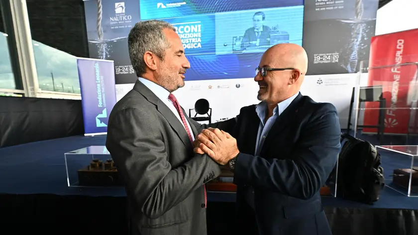 L'amministratore delegato di Leonardo Roberto Cingolani e Pierroberto Folgiero amministratore delegato di Fincantieri, durante il convegno su Guglielmo Marconi alla 64ma edizione del Salone Nautico. Genova, 20 settembre 2024. ANSA/LUCA ZENNARO NPK