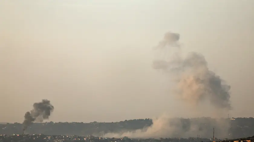 epa11734833 Smoke rises as a result of an Israeli airstrike on the village of Al-Khiam in southern Lebanon, as seen from the Israeli side of the border, northern Israel, 22 November 2024, amid cross-border hostilities between Hezbollah and Israel. Israel's military stated on 22 November, that following sirens that sounded in the Haifa Bay area, approximately five projectiles were identified crossing from Lebanon into Israeli territory. EPA/ATEF SAFADI