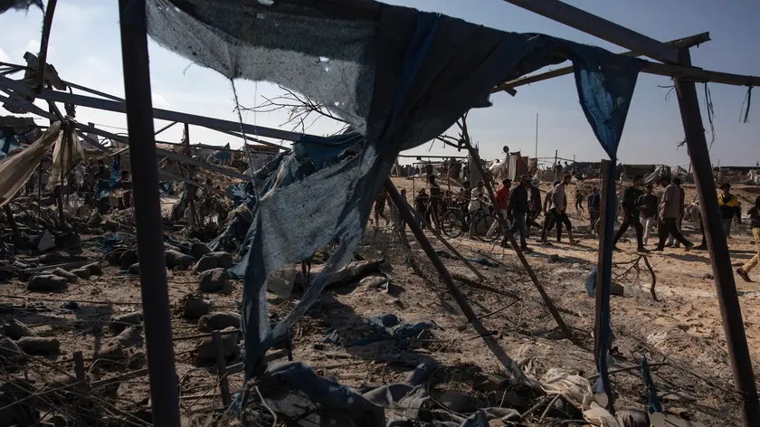 epa11718197 Palestinians inspect the damage following Israeli shelling at a camp housing internally displaced people in Khan Younis, southern Gaza Strip, 13 November 2024. More than 43,700 Palestinians and over 1,400 Israelis have been killed, according to the Palestinian Health Ministry and the Israeli Army, since Hamas militants launched an attack against Israel from the Gaza Strip on 07 October 2023, and the Israeli operations in Gaza and the West Bank which followed it. EPA/HAITHAM IMAD