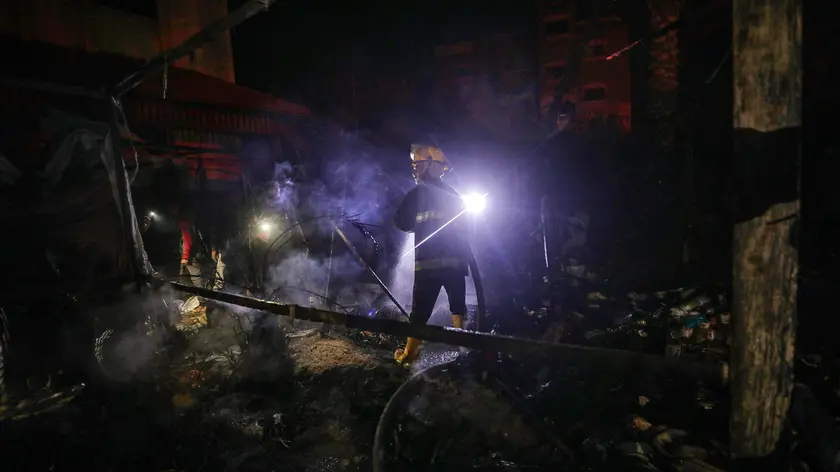 epa11717425 Palestinian Civil Defense personnel put out a fire burning in destroyed tents of internally displaced Palestinians following an Israeli air strike in the west of Deir Al Balah town, central Gaza Strip, 12 November 2024. According to the Palestinian Ministry of Health in Gaza, at least two Palestinians were killed and another ten wounded in the Israeli airstrike. More than 43,600 Palestinians and over 1,400 Israelis have been killed, according to the Palestinian Health Ministry and the Israeli Army, since Hamas militants launched an attack against Israel from the Gaza Strip on 07 October 2023, and the Israeli operations in Gaza and the West Bank which followed it. EPA/MOHAMMED SABER