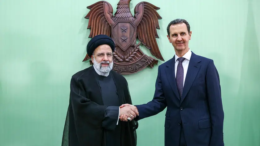 epa10606473 A handout picture made available by the Iranian presidential office shows Iranian President Ebrahim Raisi (L) and his Syrian counterpart Bashar Assad (R) shaking hands during press conference in Damascus, Syria, 03 May 2023. Raisi, the first Iranian president to visit Damascus since war erupted in Syria in 2011, had talks with his Syrian counterpart and signed a memorandum of understanding for a comprehensive long-term strategic cooperation plan between the two countries. EPA/IRANIAN PRESIDENCY OFFICE / HANDOUT HANDOUT EDITORIAL USE ONLY/NO SALES