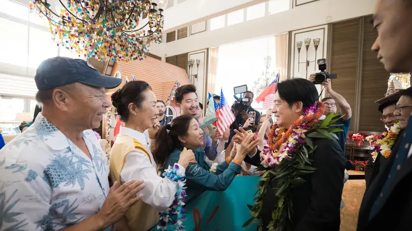 epa11750901 A handout photo made available on 01 December 2024 shows Taiwan President William Lai (Lai Ching-te) (C) greeted by Hawaiian-based Taiwanese upon his visit at the Bishop Museum in Honolulu, Hawaii, USA, 30 November 2024. Lai and his delegation arrived in Hawaii for a two-night layover before continuing their Pacific island tour to the Marshall Islands and Tuvalu, according to Taiwan's Presidential Office official. EPA/LIU SHU FU/TAIWAN PRESIDENTIAL O HANDOUT HANDOUT EDITORIAL USE ONLY/NO SALES