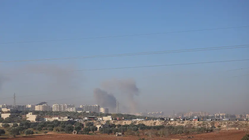 epa11751377 Smoke rises as a result of an airstrike in Idlib, northern Syria, 01 December 2024. According to the White Helmets, the Syrian civil group in northwestern Syria, at least eight people, including two children, were killed and 63 others injured in airstrikes carried out on residential neighborhoods in Idlib city. Syrian opposition forces led by the Islamist militant group Hayat Tahrir al-Sham (HTS) launched a large offensive on 27 November, taking large parts of Aleppo, the country's second-biggest city, triggering counterattacks by Syrian regime forces on opposition-controlled areas as well as Russian and Syrian airstrikes. EPA/MOHAMMED AL-RIFAI