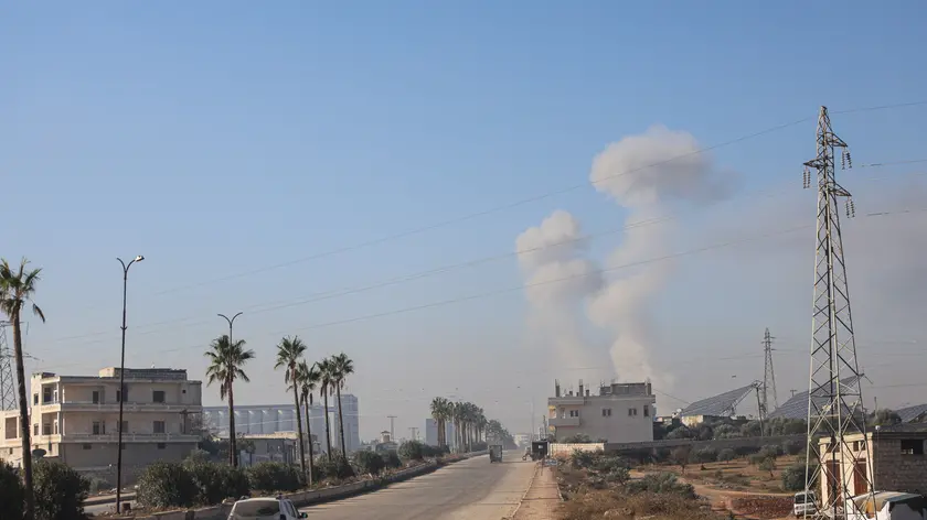 epa11751376 Smoke rises as a result of an airstrike in Idlib, northern Syria, 01 December 2024. According to the White Helmets, the Syrian civil group in northwestern Syria, at least eight people, including two children, were killed and 63 others injured in airstrikes carried out on residential neighborhoods in Idlib city. Syrian opposition forces led by the Islamist militant group Hayat Tahrir al-Sham (HTS) launched a large offensive on 27 November, taking large parts of Aleppo, the country's second-biggest city, triggering counterattacks by Syrian regime forces on opposition-controlled areas as well as Russian and Syrian airstrikes. EPA/MOHAMMED AL-RIFAI