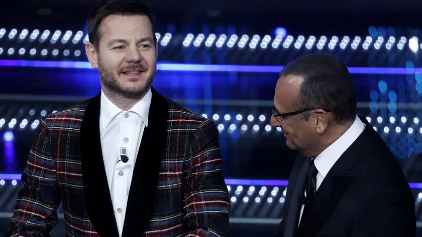 Saranno Alessandro Cattelan (nella foto insieme a Carlo Conti) e Alessia Marcuzzi i co-conduttori della finale di Sanremo