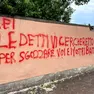 La scritta comparsa il 14 maggio scorso sul muro del galoppatoio al Lido di Venezia