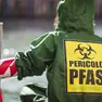 Un’attivista di Greenpeace durante una protesta anti Pfas. Foto Ansa
