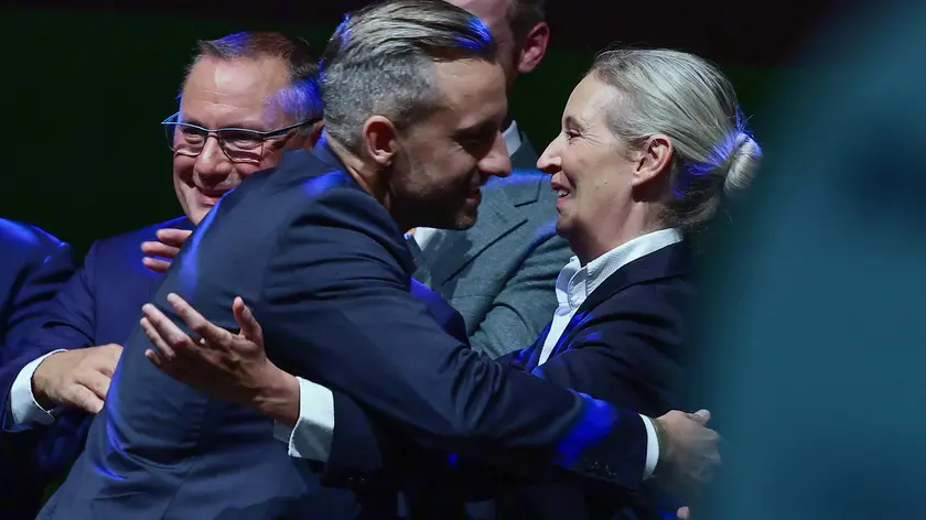epa13218294 Top candidate Ulrich Siegmund (C) poses with party and parliamentary group co-chairwoman Alice Weidel (R) and party and parliamentary group co-chairman Tino Chrupalla during a far-right Alternative for Germany (AfD) election party following Saxony-Anhalt state election, in Magdeburg, Germany, 06 September 2026. Voters in Saxony-Anhalt are casting ballots to elect a new state parliament. EPA/FILIP SINGER