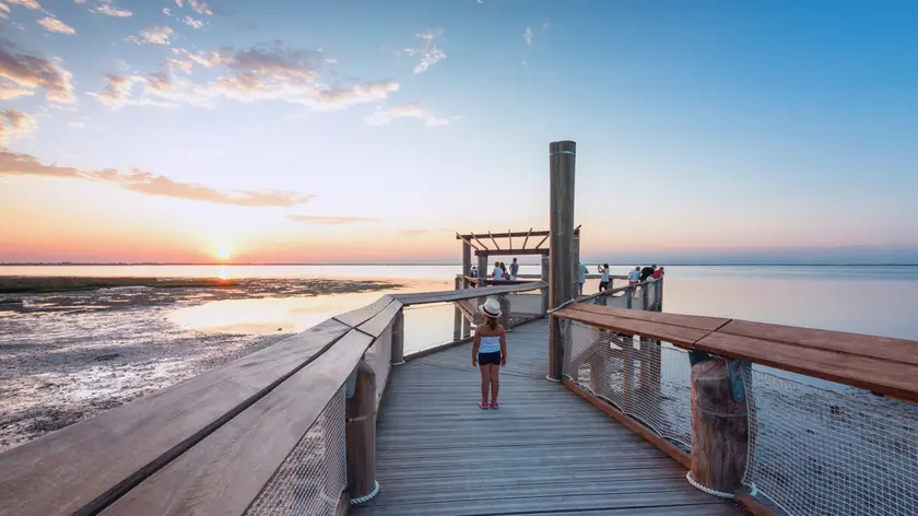 Lignano Sabbiadoro, Province of Udine, Friuli-Venezia Giulia, Italy. Sunset over lagoon of Lignano Sabbiadoro