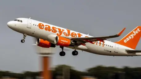 (FILES) In this file photo taken on August 25, 2017 an aircraft of British low-cost airline EasyJet takes off from Lille Airport in Lesquin, northern France. - Airline EasyJet said Thursday it would be able to withstand an extended period of paralysis in air traffic due to the novel coronavirus COVID-19, after taking several measures to strengthen its finances. (Photo by PHILIPPE HUGUEN / AFP)