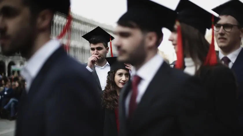 12/04/2019 Venezia, Laurea day dell'Universita' Ca' Foscari, cerimonia di laurea in Piazza San Marco, una giornata dedicata a tutti i laureandi. Gli studenti indossano il Tocco