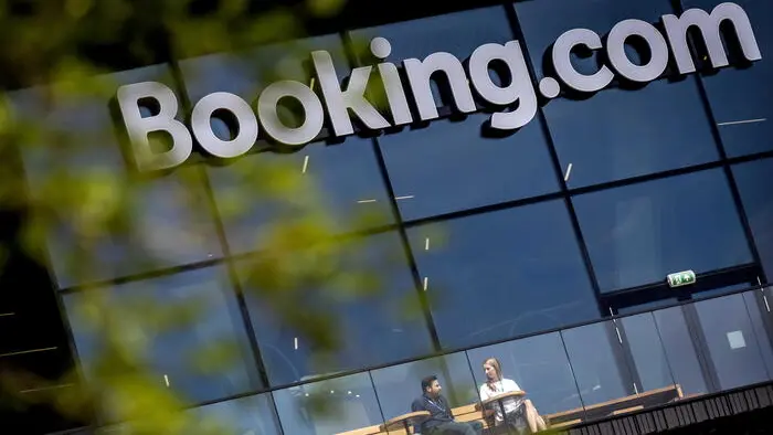 epa10712153 An exterior view of the Booking.com headquarters in Amsterdam, the Netherlands, 26 June 2023. The new international campus of the originally Dutch hotel booking platform offers more than 5,000 employees a workplace. The online travel company's new offices opened on 26 June. EPA/KOEN VAN WEEL