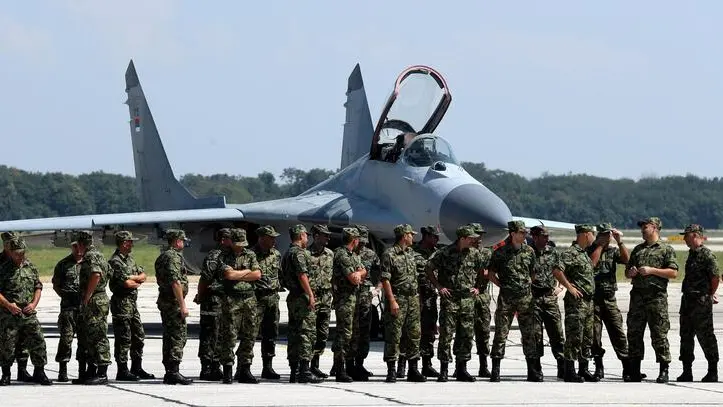epa06962760 Members of the Serbian Army Air Force attend the presentation of the MIG 29 aircraft at the military airport in Batajnica, Belgrade, Serbia, August 21, 2018. Russia gave the Serbian army six MIG 29 airplanes of which two passed the first phase of reparations and modifications. EPA/KOCA SULEJMANOVIC