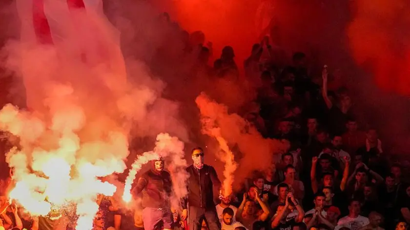 Red Star fans light fireworks during an international friendly soccer match between Red Star and Fiorentina at the Rajko Mitic Stadium in Belgrade, Serbia, Wednesday, July 26, 2023. (AP Photo/Darko Vojinovic)