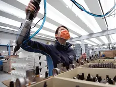 A worker of the Polini company at work wearing a protective mask, Alzano Lombardo, Bergamo, 06 March 2020. The factory is located in Alzano Lombardo one of the villages in the province of Bergamo which risks becoming "red zone" due to the spread of Coronavirus.. According to official figures the number of Coronavirus cases in Italy, the center of Europe's COVID-19 outbreak, was at 3,858 cases by 06 March with a death toll of 148 people while 414 people have recovered since the outbreak. ANSA/MATTEO BAZZI