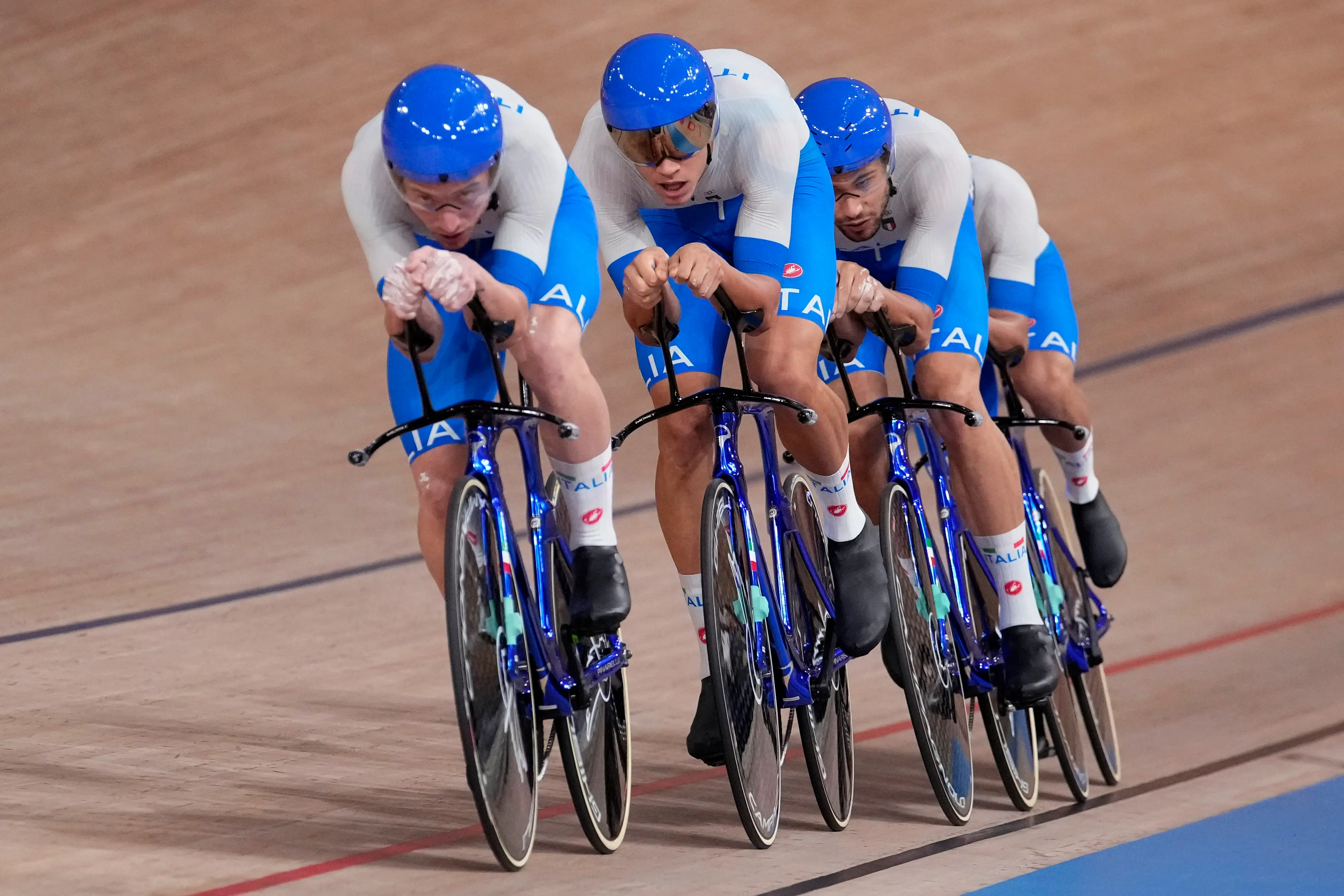 Team Italy competes during the track cycling men\'s team pursuit at the 2020 Summer Olympics, Wednesday, Aug. 4, 2021, in Izu, Japan. (AP Photo/Christophe Ena)