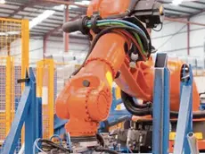 11 Feb 2013 --- Robotic machinery lifting steel gates in factory --- Image by © Ian Lishman/Juice Images/Corbis