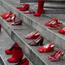 In occasione della giornata mondiale contro la violenza sulle donne, il teatro Regio di Parma ha posizionato sugli scalini dell'ingresso alcune scarpe rosse, 25 novembre 2019. ANSA/SANDRO CAPATTI