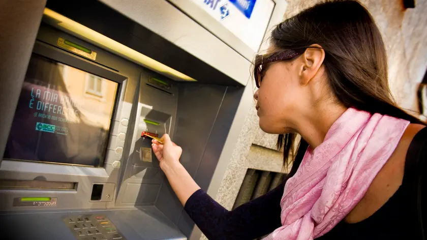 Woman using an ATM machine