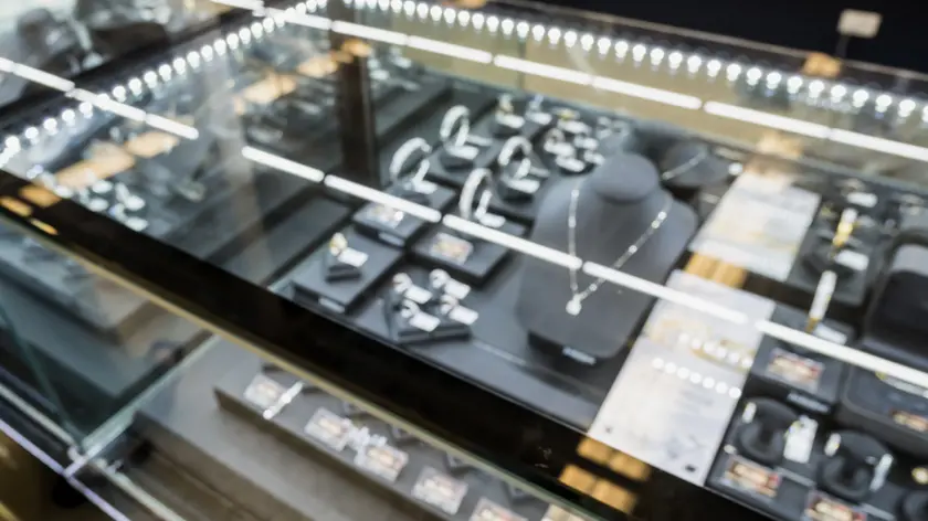 jewelry diamond store window display blurred background with bokeh light