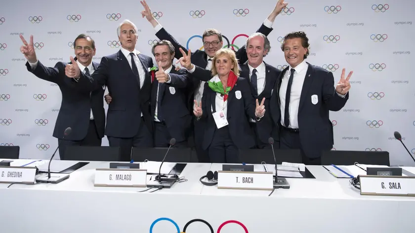 epaselect epa07671003 (L-R) the Mayor of Milan Giuseppe Sala, Italy's National Olympic Committee (CONI) president Giovanni Malago, Italy's Lombardy region President Attilio Fontana, Italy's Under Secretary of State Giancarlo Giorgetti, Italy's Olympic Gold Medallist in Fencing Diana Bianchedi, Italy's Veneto Region President Luca Zaia and Mayor of Cortina Gianpietro Ghedina pose after Milan-Cortina in Italy has won the bid to host the 2026 Winter Olympic Games the first day of the 134th Session of the International Olympic Committee (IOC), at the SwissTech Convention Centre, in Lausanne, Switzerland, 24 June 2019. EPA/LAURENT GILLIERON