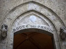 epa05602059 (FILE) A file picture dated 23 March 2016 shows Banca Monte dei Paschi di Siena (BMPS or MPS) headquarters in Piazza Salimbeni, in Siena, Italy. MPS said in a statement on 25 October 2016, it would cut around 2,600 jobs and shut 500 branches as part of its reforming plans between the years 2016 to 2019. MPS board has called for an extraordinary shareholders' meeting on 24 November to approve a capital increase of 5 billion euro aimed to save the troubled Italian commercial bank. EPA/MATTIA SEDDA