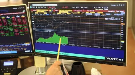 A financial journalist checks the course of the "spread" caused by the nervousness of the markets due to political uncertainty in Rome, Italy, 29 May 2018. The spread between Italy's 10-year BTP bond and the German Bund dropped back to 282 basis points on Tuesday with a yield of 3.1%. The spread had reached 320 points with a yield of 3.4% at one stage earlier on Tuesday. ANSA/LUCIANO DEL CASTILLO