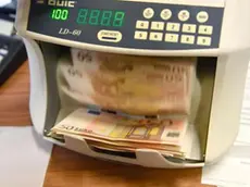 Alcune banconote da 50 Euro in un conta soldi bancario. 16 aprile 2018 a Genova. ANSA/LUCA ZENNARO